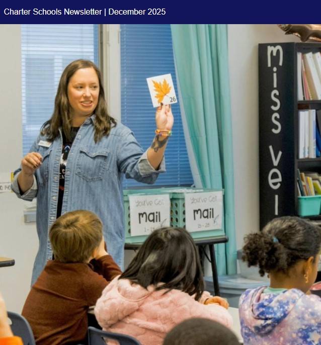 A teacher showing a flashcard to her students.